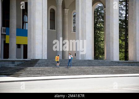 Tourists at the entrance to the majestic Ozurgeti Drama Theater in Ozurgeti in Guria region, Georgia Stock Photo