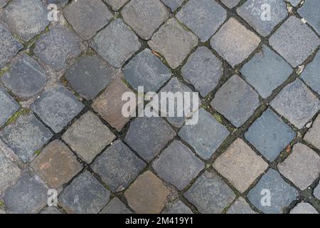 Paving slabs diagonally. The tiles are square-shaped, laid out diagonally. Street background motive Stock Photo