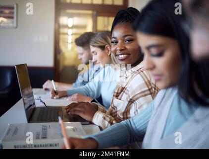 Black woman, student and smile with laptop for education, learning or university scholarship in class. Portrait of African American female learner Stock Photo