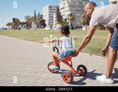 Child, girl or father pushing bike on city promenade for riding learning, cycling education or Brazilian freedom fun. Smile, happy or bonding man with Stock Photo