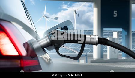 Close up of fuel cell car with connected hydrogen fueling nozzle on a background of H2 filling station using renewable energy. Clean mobility concept Stock Photo