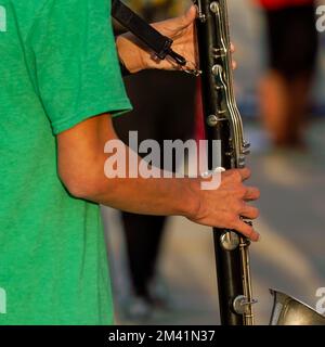 hands of a musician playing a clarinet at rehearsal Stock Photo