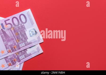 500 euro banknotes on a red background Stock Photo