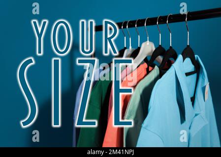 Clothes for sale are hanging on a hanger. Men's T-shirts, Women's Blouses Stock Photo