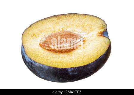 Half of blue plum with stone over  isolated on white background. Package design element. File contains clipping path. Stock Photo