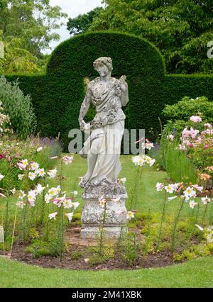 Garden Statue with Lilly's Helmingham Hall Stock Photo