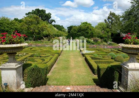 Entrance to Parterre Garden flanked with stone urns in summer with blue sky and figures Landscape view Stock Photo