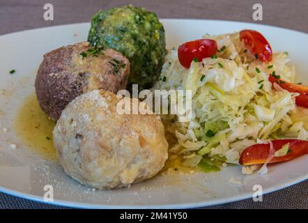 Knödel or Canederli bread dumplings with cabbage, a typical speciality of Alto Adige or South Tyrol, Italy Stock Photo