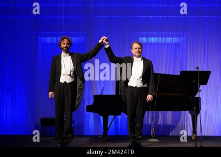 Polish bass-baritone Tomasz Konieczny (right) celebrates his 25-years anniversary of being professional opera singer with pianist Lech Napierła (left) Stock Photo