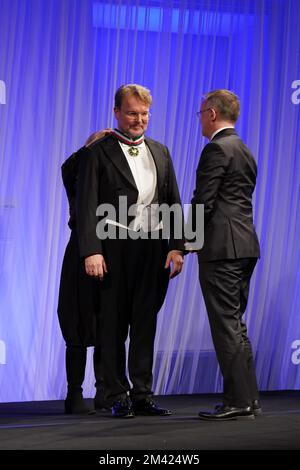 Jarosław Sellin (right) awards singer Tomasz Konieczny (left) by gold medal for Merit to Culture – Gloria Artis for his 25-years carrer Stock Photo