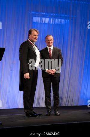 Jarosław Sellin (right) awards singer Tomasz Konieczny (left) by gold medal for Merit to Culture – Gloria Artis for his 25-years carrer Stock Photo