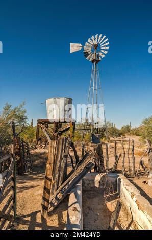 Windmill, water tank, watering trough, Bates Well Ranch, El Camino del Diablo, Organ Pipe Cactus National Monument, Arizona, USA Stock Photo