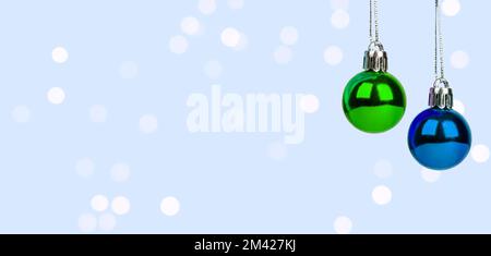 Christmas baubles, green and blue balls hanging on string, ad banner, background with copy space for text. High quality photo Stock Photo