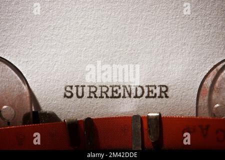 Surrender word written with a typewriter. Stock Photo