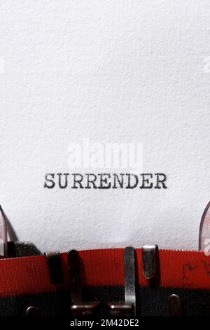 Surrender word written with a typewriter. Stock Photo