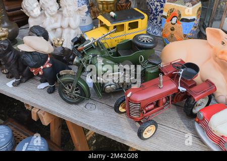 Tongeren. Limburg - Belgium 13-02-2022. Flea market in the city. Old toys on the counter. Model of tractor, motorcycle, etc. Stock Photo
