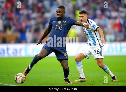 France's Marcus Thuram (left) and Argentina's Nahuel Molina battle for the ball during the FIFA World Cup final at Lusail Stadium, Qatar. Picture date: Sunday December 18, 2022. Stock Photo