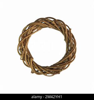 Christmas wreath made of twigs with gilding. Square format. Close-up, texture. On a white background Stock Photo