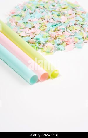 Drinking straws and microplastics on a white background. Impact of micro plastic on the food chain. The idea of micro plastic pollution. Concept Stock Photo