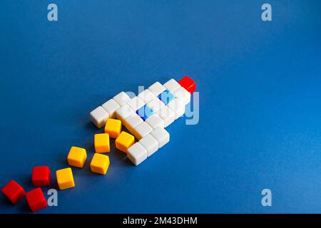 Rocket from blocks on takeoff. Concept of a successful start of a business project. Investments in the development of high-tech highly profitable area Stock Photo