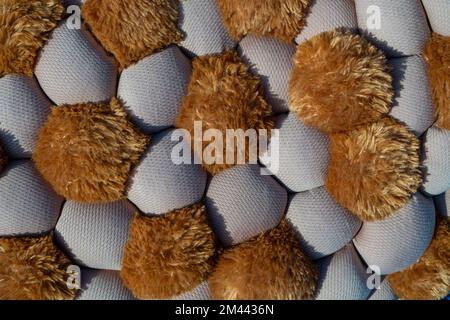 Different sizes, quantities of stuffed balls of fabric with sintepon. Soft decorative material Stock Photo