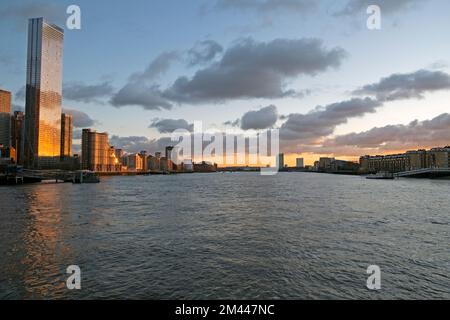 View of riverside corporate buildings at Canary Wharf buildings on Isle of Dogs from River Thames at dusk Isle of Dogs London UK 2022  KATHY DEWITT Stock Photo