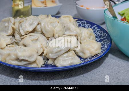 Fresh steamed dumplings or manti. Traditional oriental food. Stock Photo