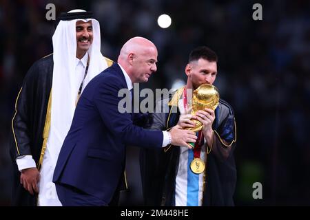 Lionel Messi Kisses His Trophy While Celebrating Win at FIFA World Cup –  Footwear News