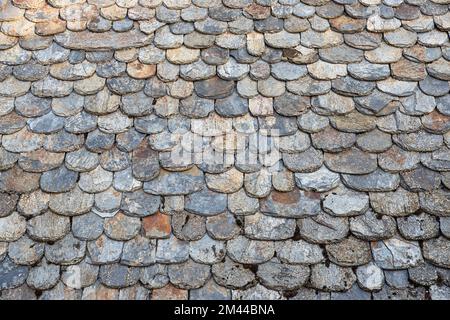Texture of old rounded tiles on a roof Stock Photo