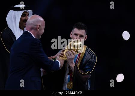 Doha, Brazil. 18th Dec, 2022. AC - Doha - 18/12/2022 - 2022 WORLD CUP FINAL, ARGENTINA VS FRANCE - The Emir of Qatar Tamim bin Hamad bin Khalifa al-Thani and FIFA President Gianni Infantino hand over the FIFA World Cup to Lionel Messi Argentina during the award ceremony after winning the match against France at the Lusail stadium for the 2022 World Cup championship decision. Photo: Pedro Martins/AGIF/Sipa USA Credit: Sipa USA/Alamy Live News Stock Photo