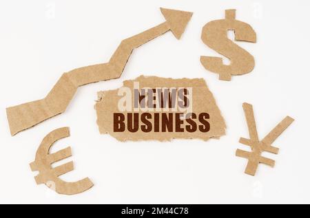 Economic concept. On a white background, symbols of the dollar, euro, yen, an arrow pointing up and a torn cardboard with the inscription - NEWS BUSIN Stock Photo