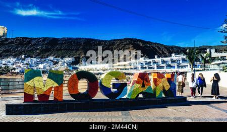 Colourful signage display for Mogan  in Puerto Mogan, Gran Canaria. Stock Photo