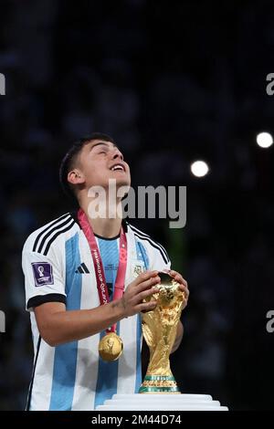 Lusail, Qatar. 18th Dec, 2022. Paulo Dybala of Argentina touches the World Cup Trophy during the awarding ceremony of the 2022 FIFA World Cup at Lusail Stadium in Lusail, Qatar, Dec. 18, 2022. Credit: Lan Hongguang/Xinhua/Alamy Live News Stock Photo