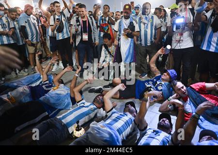 Lusail, Qatar. 18th Dec, 2022. Fans of Argentina celebrate after the team winning the 2022 FIFA World Cup at Lusail Stadium in Lusail, Qatar, Dec. 18, 2022. Credit: Xiao Yijiu/Xinhua/Alamy Live News Stock Photo
