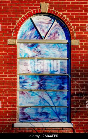 A stained glass window is pictured at Magnolia Springs Baptist Church,  Dec. 16, 2022, in Theodore, Alabama. The church was founded in 1989. Stock Photo