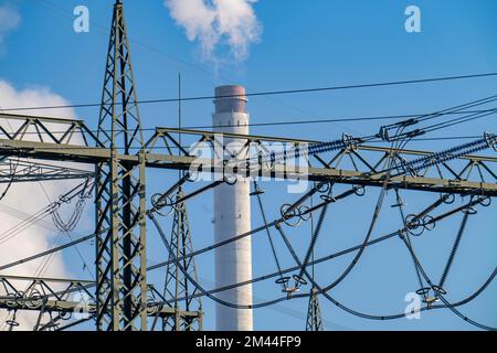 380 kV system, switchgear, from the transmission grid operator Amprion, in the Emscherbruch in Herten, chimney of the STEAG combined heat and power pl Stock Photo