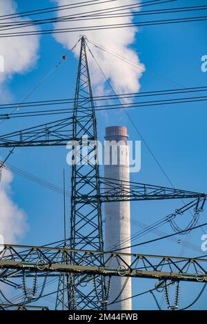 380 kV system, switchgear, from the transmission grid operator Amprion, in the Emscherbruch in Herten, chimney of the STEAG combined heat and power pl Stock Photo