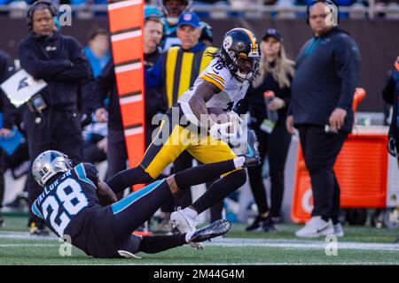 December 18, 2022: Pittsburgh Steelers wide receiver Diontae Johnson (18) slips away from Carolina Panthers cornerback Keith Taylor Jr. (28) during the second half of the NFL matchup in Charlotte, NC. (Scott Kinser/Cal Sport Media) Stock Photo