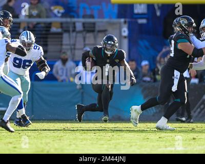 December 18, 2022: Dallas Cowboys quarterback DAK PRESCOTT (4) gets tackled  during the Jacksonville Jaguars vs Dallas Cowboys NFL game at TIAA Bank  Field Stadium in Jacksonville, Fl on December 18, 2022. (