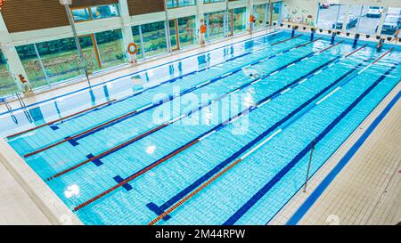 05.12.2022 Ozarow Mazowiecki, Poland - High angle shot of a swimming pool with a single person. High quality photo Stock Photo