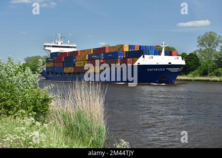 Container ship Enforcer sails through the Kiel Canal, Schleswig-Holstein, Germany Stock Photo