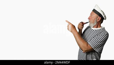 Cheerful sailor in profile on a white background. An old sailor with a smoking pipe and a raised index finger. Banner Stock Photo