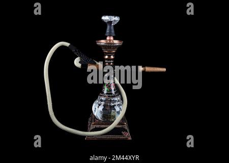 Modern old brass hookah isolated on black background. whole object copy paste Stock Photo