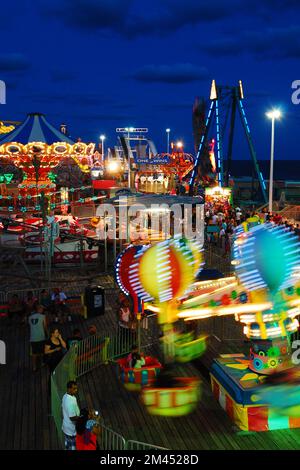 The lights of Casino Pier in Seaside Heights on the Jersey Shore glow in the summer night.  The pier was destroyed by Hurricane Sandy and rebuilt Stock Photo