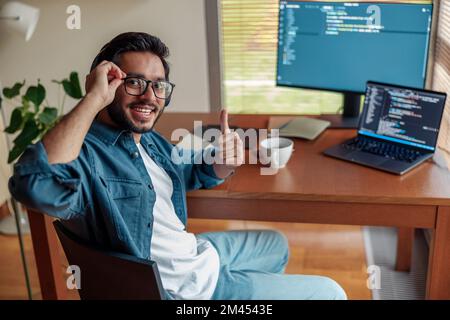 Male freelancer making new project as web designer or programmer on his computer at home office Stock Photo