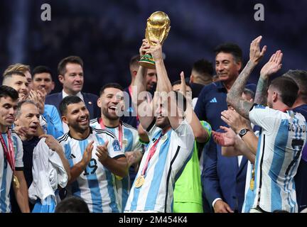 Qatar - 18/12/2022, Nicolas Tagliafico of Argentina - holding the World Cup - and teammates celebrate during the trophy ceremony following the FIFA World Cup 2022, Final football match between Argentina and France on December 18, 2022 at Lusail Stadium in Al Daayen, Qatar - Photo Jean Catuffe / DPPI Stock Photo