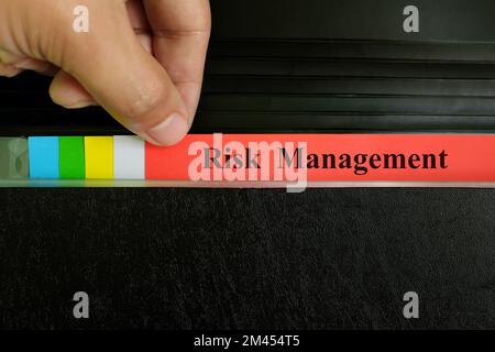 Risk management file record in black binder folder. Risk management ...