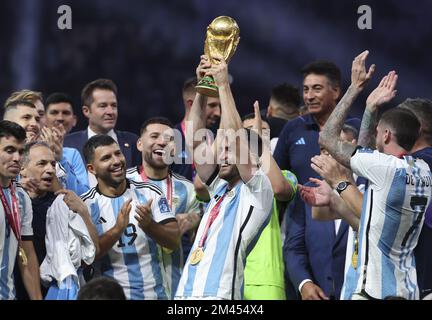 Al Daayen, Qatar - 18/12/2022, Nicolas Tagliafico of Argentina - holding the World Cup - and teammates celebrate during the trophy ceremony following the FIFA World Cup 2022, Final football match between Argentina and France on December 18, 2022 at Lusail Stadium in Al Daayen, Qatar - Photo: Jean Catuffe/DPPI/LiveMedia Stock Photo