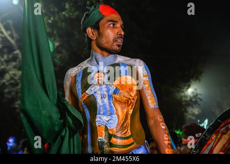 Dhaka, Bangladesh. 19th Dec, 2022. Argentinian supporter celebrates their victory against France as they watch the FIFA World Cup Qatar 2022 final match between Argentina and France on a big screen at the University of Dhaka area in Dhaka. Credit: SOPA Images Limited/Alamy Live News Stock Photo