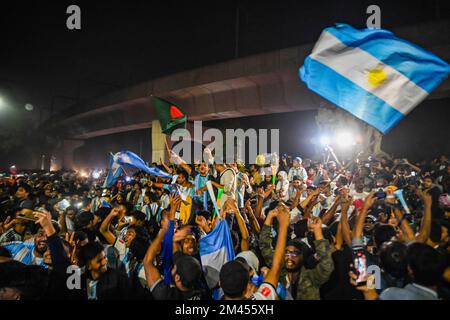 Dhaka, Bangladesh. 19th Dec, 2022. Argentina fans celebrate the victory against France, as they watch a FIFA World Cup Qatar 2022 final match between Argentina and France on the big screen, at the University of Dhaka. Credit: SOPA Images Limited/Alamy Live News Stock Photo